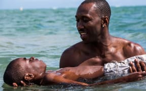 Mahershala Ali and Alex R. Hibbert in Moonlight (2016)