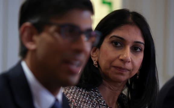 Britain's Prime Minister Rishi Sunak (L) and Britain's Home Secretary Suella Braverman attend a meeting with local community and police leaders following the announcement of a new police task force to help officers tackle grooming gangs, in Rochdale, northern England on April 3, 2023. (Photo by PHIL NOBLE / POOL / AFP)