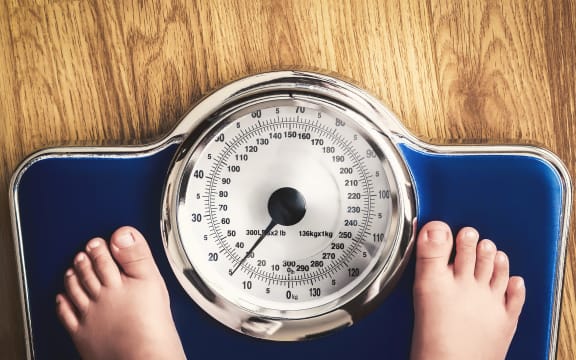 kids feet on weight scale