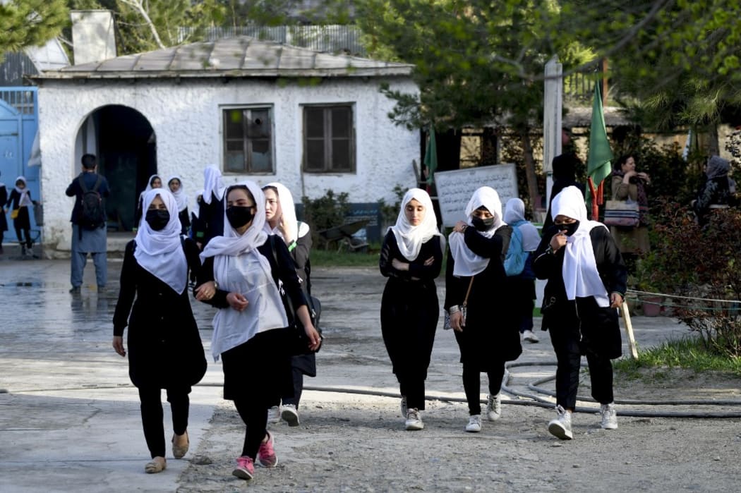 CAPTION ADDITION - updated information - 
Girls arrive at their school in Kabul on March 23, 2022. - The Taliban ordered girls' secondary schools in Afghanistan to shut on March 23 just hours after they reopened, an official confirmed,
