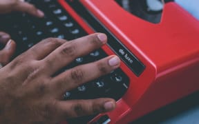 man on typewriter