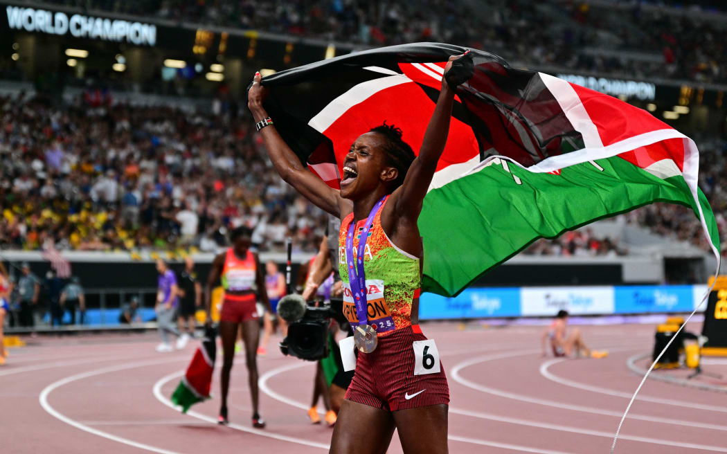 Kenya's Faith Kipyegon celebrates after winning the women's 1500m final during the World Athletics Championships in Tokyo on September 16, 2025. (Photo by Andrej ISAKOVIC / AFP)