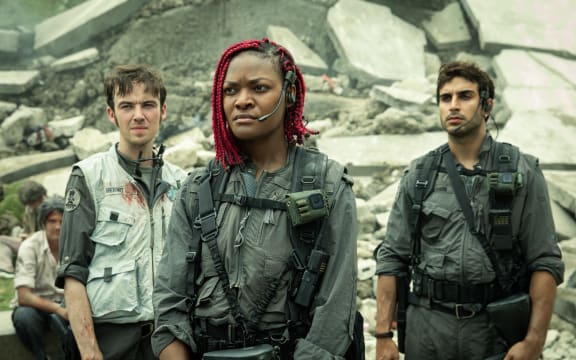 FX's Alien: Earth -- Pictured: (l-r) Alex Lawther as Hermit, Diêm Camille as Siberian, Moe Bar-El as Rashidi. CR: Patrick Brown/FX
