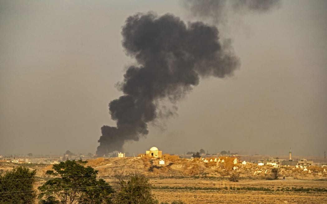 Smoke billows following Turkish bombardment on Syria's northeastern town of Ras al-Ain in the Hasakeh province along the Turkish border on October 9, 2019.
