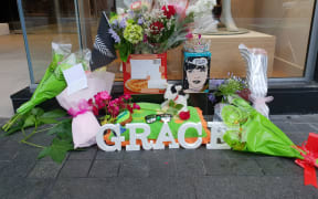 Flowers laid outside CityLife Hotel where Grace was last seen alive on 1 December.