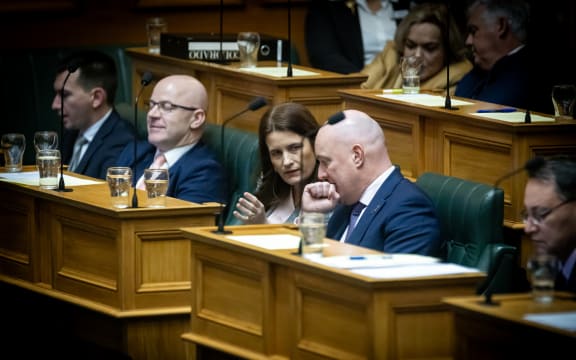 Nicola Willis shares some tactical thoughts with Christopher Luxon during Question Time in Parliament's Debating Chamber.