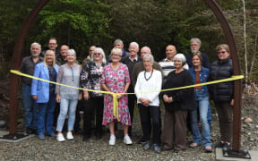 Members of the Pike River families gather at the entrance of the newly opened Pike 29 Memorial Track.