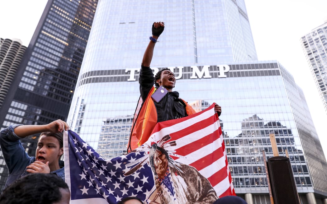 Native American protestors are joined by anti-Trump and other protestors as they march showing their opposition to the Dakota Access Pipeline, in Chicago, Illinois, USA, 12 November 2016.