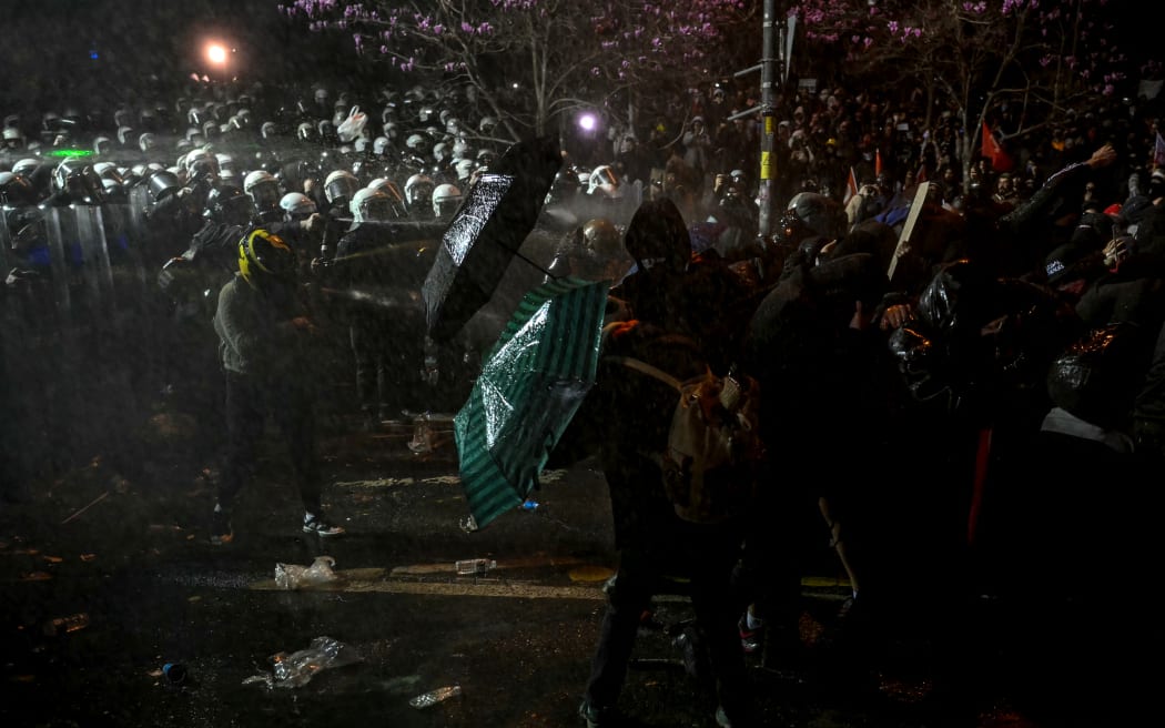 Turkish riot police use tear gas, on 22 March, 2025, to disperse protesters gathering outside Istanbul's city hall to support Istanbul mayor Ekrem Imamoglu following his arrest in connection with two probes.