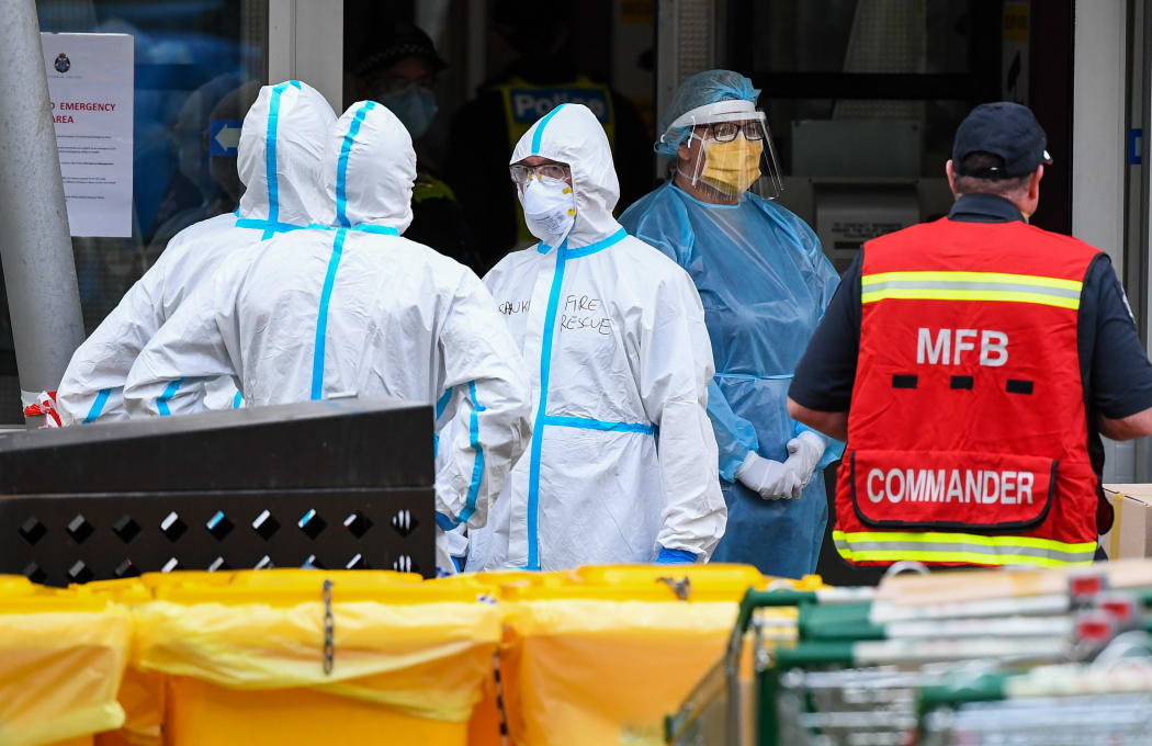 Members of the Melbourne Fire Brigade (MFB) prepare to take food parcels to residents in a locked down public housing estate in Melbourne on 9 July, 2020 as the city re-enters a city wide lockdown after a fresh outbreak of the Covid-19 coronavirus.`
