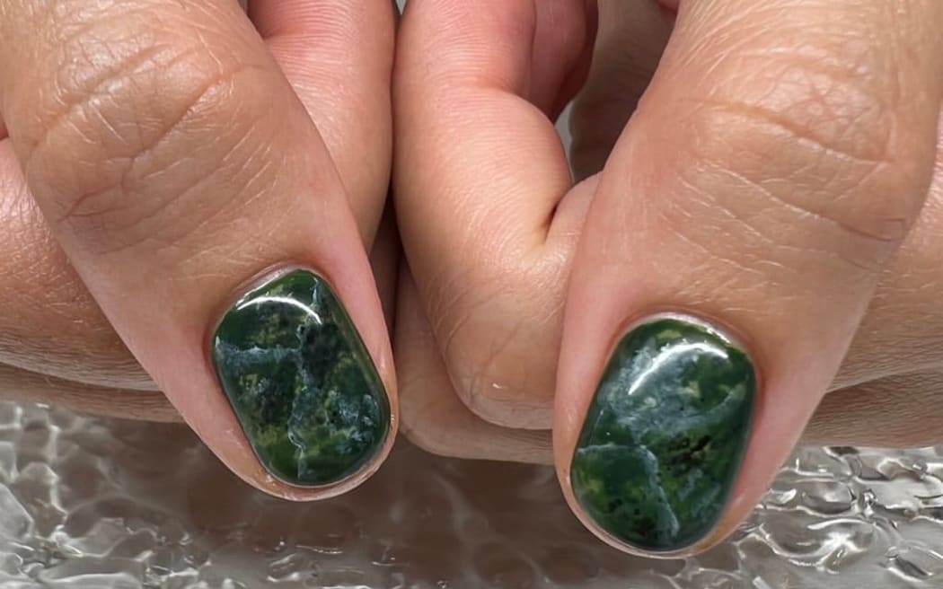 Nails painted with a pounamu design by Auckland nail artist Tanya Barlow