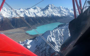 Aviation Adventures owner Chris Rudge says he was over Aoraki / Mt Cook at the exact same time as the first flight 100 years ago to the day.