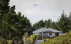 Fire and Emergency crews respond to a blaze at Pines Beach, near Kaiapoi north of Christchurch, on 25 January.