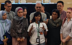 Grace Subathirai Nathan (C), daughter of missing Malaysia Airlines flight MH370 passenger Anne Daisy, speaks during a press conference after being presented with the final investigation report on the missing flight, in Putrajaya, outside Kuala Lumpur, on July 30, 2018.
