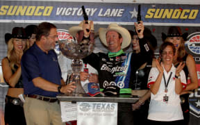 Scott Dixon celebrates his victory