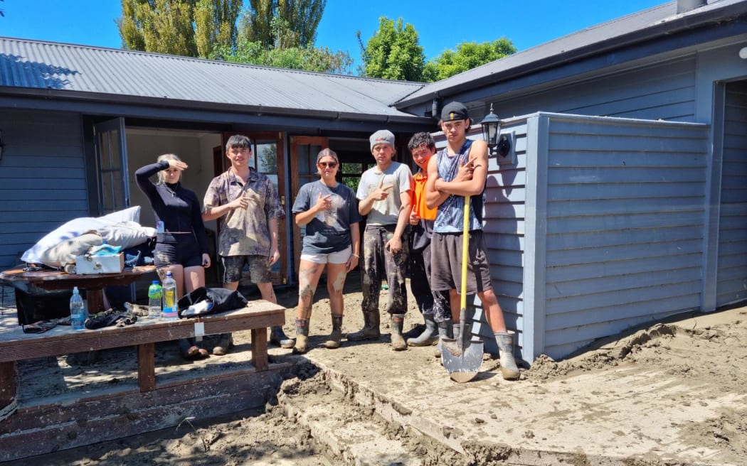Residents gather in Waiohiki during a clean-up on Saturday.