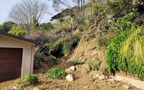 Mud and debris behind Andy Kenton's house following the 2022 August floods.
