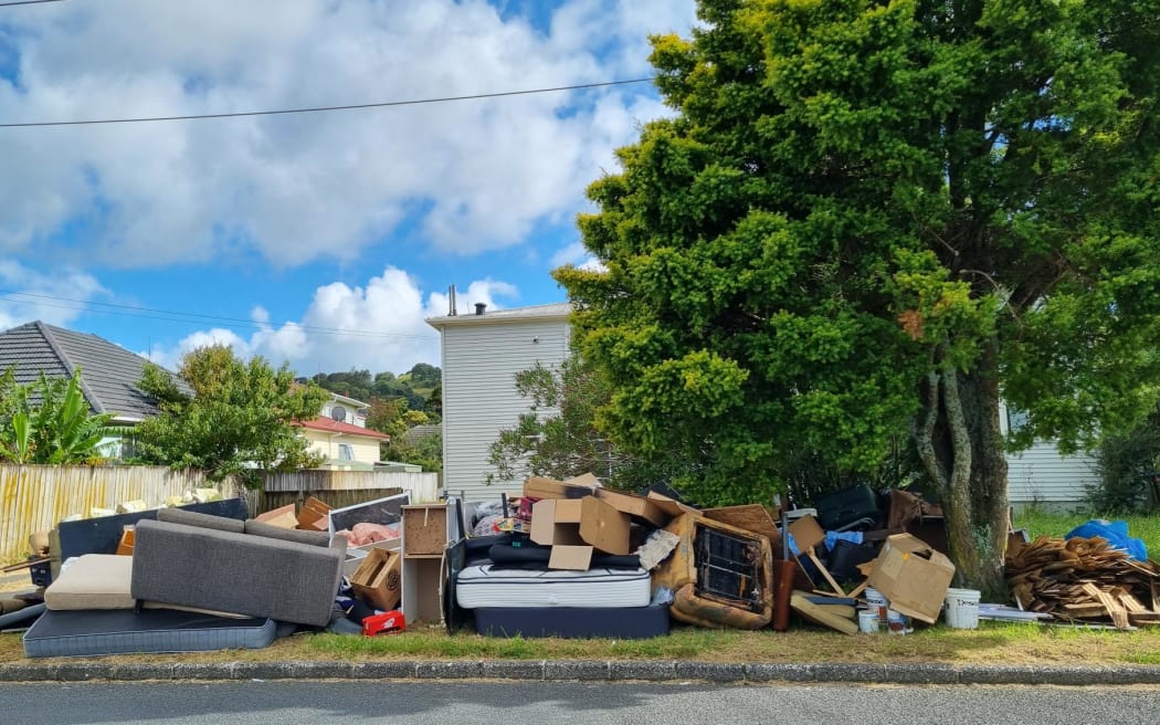 Household items still wait on the kerbside in Auckland's Mount Roskill.