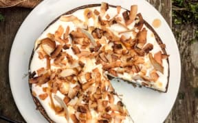 A flour-free coffee and cardamom cake with whipped coconut icing.
