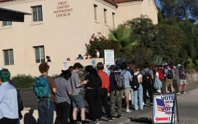 TUCSON, ARIZONA - NOVEMBER 08: Voters wait to cast their ballots on November 08, 2022 in Tucson, Arizona. After months of candidates campaigning, Americans are voting in the midterm elections to decide close races across the nation.   Kevin Dietsch/Getty Images/AFP (Photo by Kevin Dietsch / GETTY IMAGES NORTH AMERICA / Getty Images via AFP)