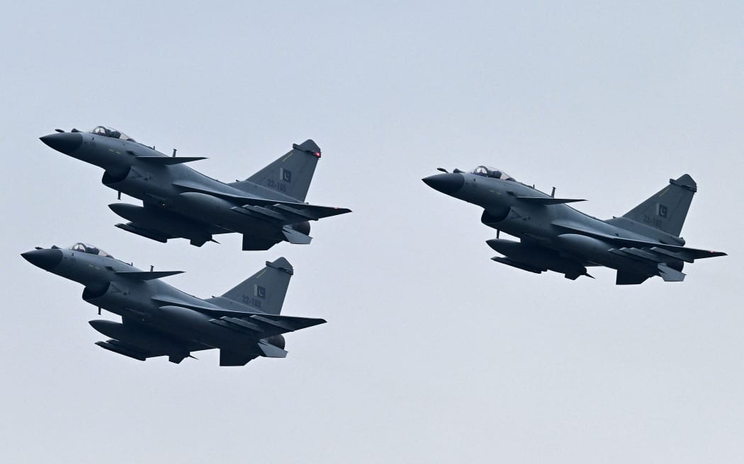 Pakistan Air Force J-10C fighter jets perform at a rehearsal ahead of Pakistan's national day parade in Islamabad on March 21, 2024. (Photo by Aamir QURESHI / AFP)