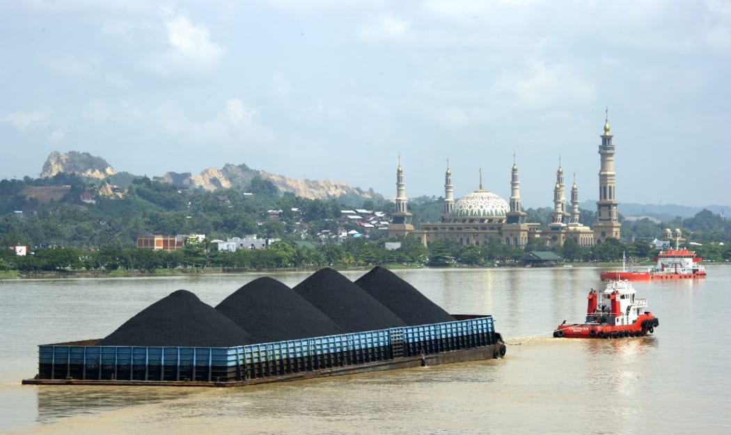 A barge on the river of Mahakam transports coal from the mining area in Samarinda, East Kalimantan in Indonesia.