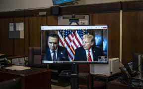NEW YORK, NEW YORK - JANUARY 10: U.S. President-elect Donald Trump appears remotely for a sentencing hearing with his attorney Todd Blanche (L) at Manhattan Criminal Court on January 10, 2025 in New York City. The U.S. Supreme Court rejected President-elect Donald Trump’s last-minute bid to halt his sentencing in the criminal hush-money case. Trump was found guilty on all 34 felony counts of falsifying business records, becoming the first former U.S. president to be convicted of felony crimes.   Jabin Botsford - Pool/Getty Images/AFP (Photo by POOL / GETTY IMAGES NORTH AMERICA / Getty Images via AFP)