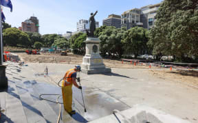 Parliament's forecourt is water blasted just a day after he police cleared the occupation.