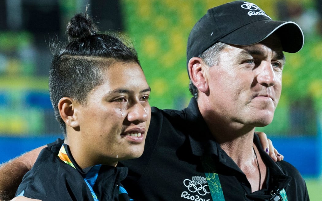 New Zealand coach Sean Horan comforts Gayle Broughton after the loss against Australia in the Women's Sevens Gold medal final, Rio Olympics.