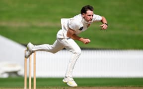 Wellington Firebirds' Nathan Smith bowling.