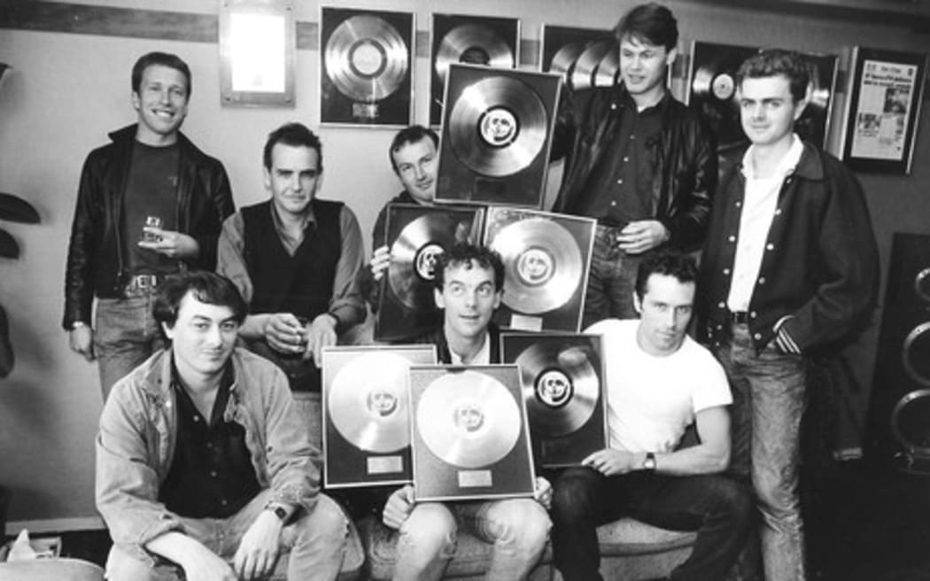 Doug Hood (front left) at a presentation of gold albums to Hunters & Collectors.