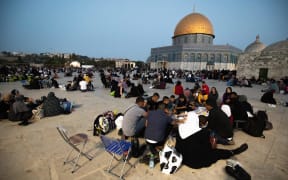Palestinians break their fast at Al-Aqsa Mosque during Laylat al-Qadr, one of their holiest nights, on 9 May.