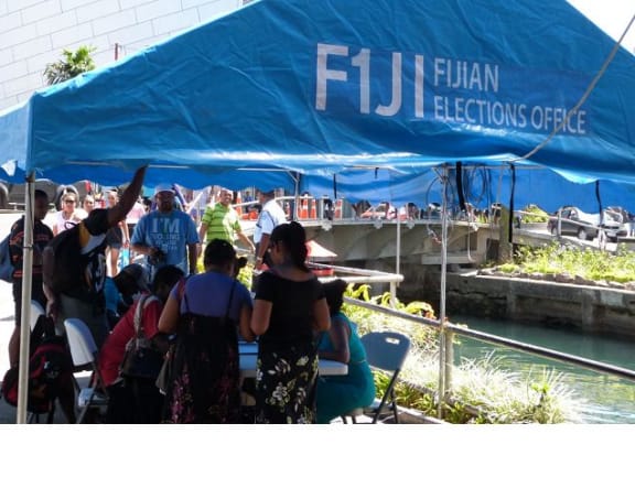 Workers from Fiji's elections office helping voters in downtown Suva ahead of polling day
