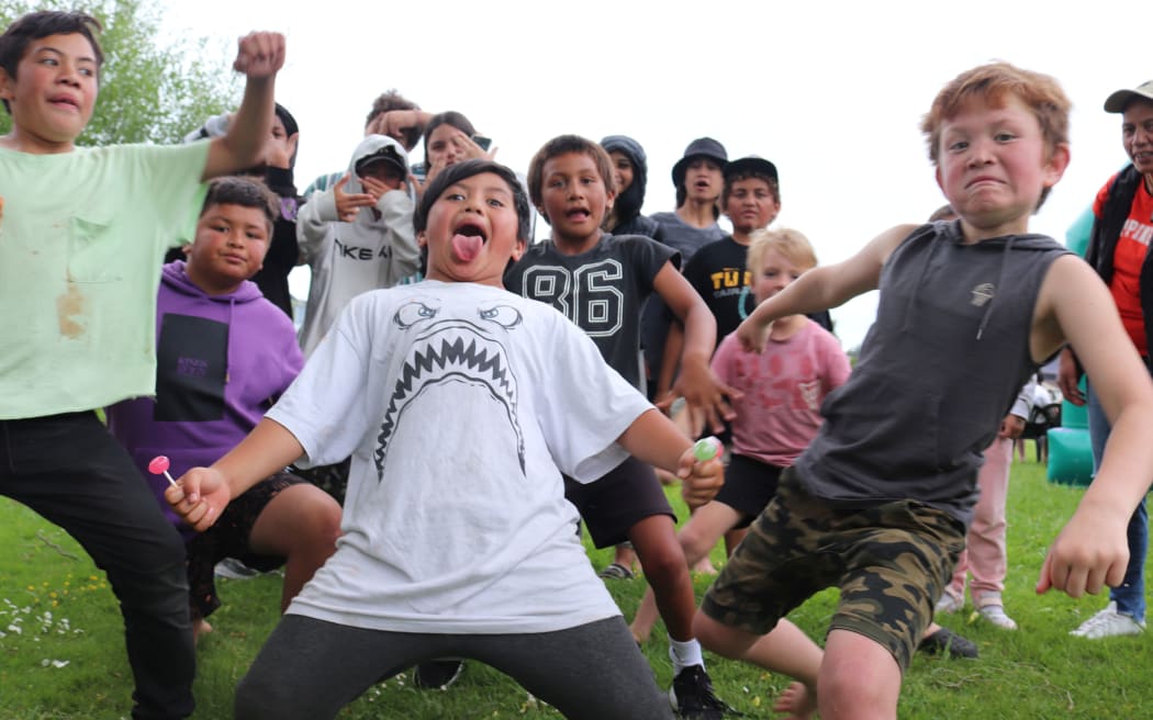 A group of tamariki enjoy the whānau day in Gisborne's Atkinson Park.