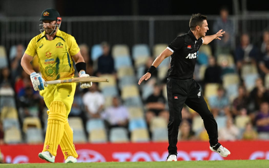 Trent Boult of New Zealand celebrates the wicket of Aaron Finch of Australia during the first One Day International in Cairns 2022.