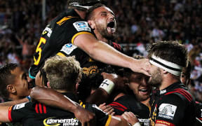 The Chiefs celebrate a try scored by Chiefs' winger James Lowe.