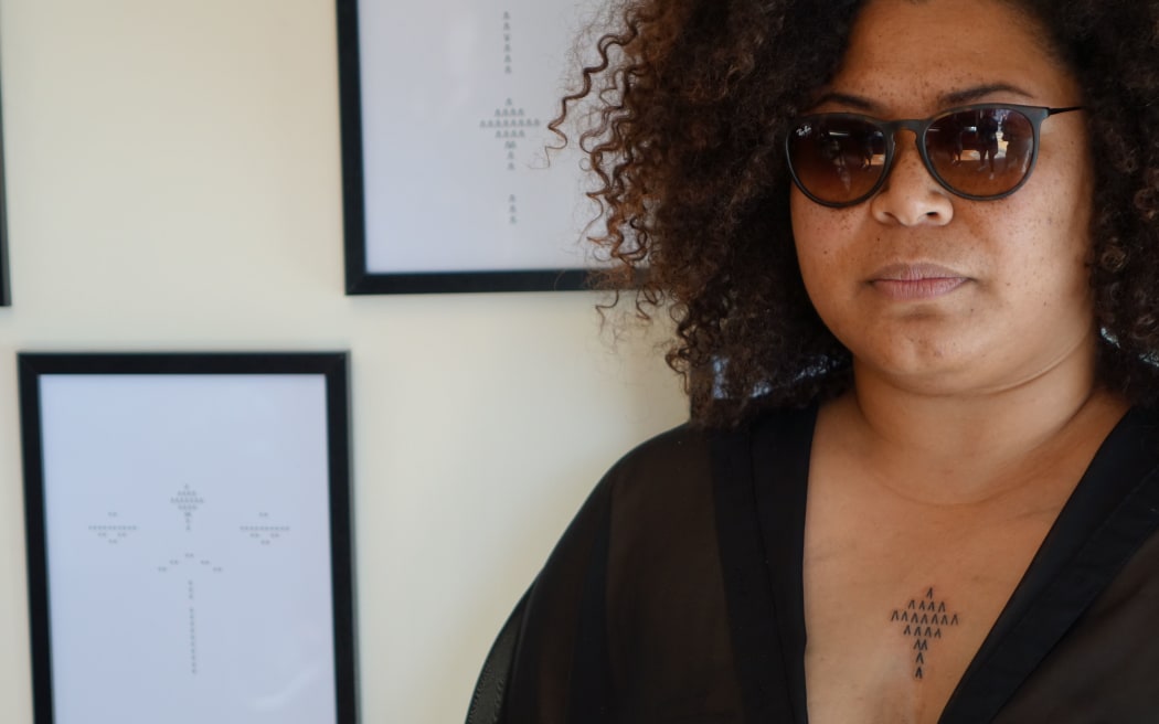 Volunteer Reina Sutton, after being tattooed on her sternum.