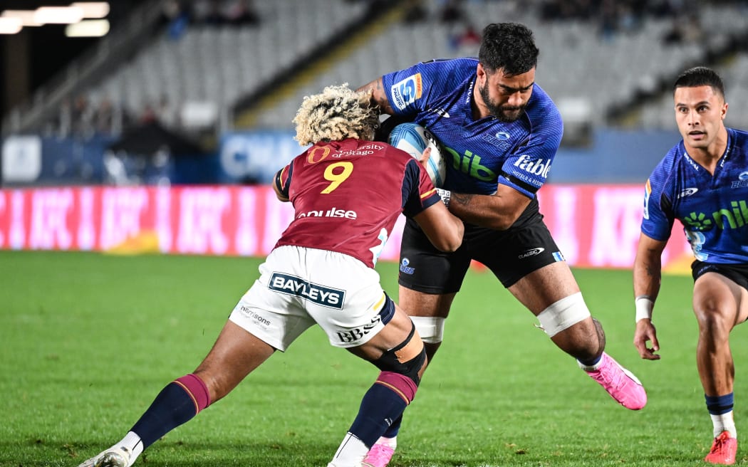 Akira Ioane of the Blues on the charge.