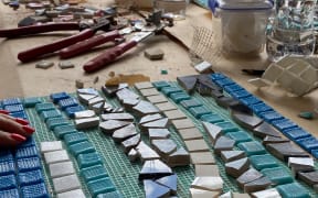 Every Saturday in November, Muriwai locals are making mosaics out of pieces of homes wrecked during Cyclone Gabrielle.