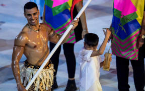 Pita Taufatofua leads the Tonga team into the stadium in Rio de Janiero.