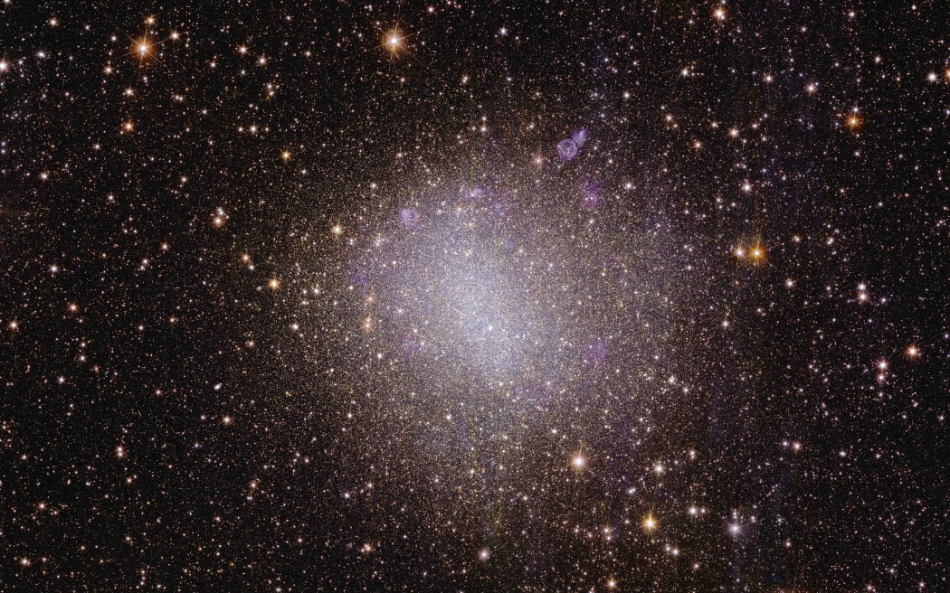 Evolved galaxies like our own Milky Way and IC 342 display beautiful spiral arms. But NGC 6822 is an example of an irregular galaxy. It doesn't have that defined shape. Many galaxies in the early Universe look like NGC 6822, although it's relatively close, just 1.6 million light-years from Earth.