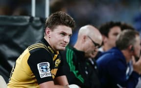 Beauden Barrett  looks on from the sin bin after being yellow carded.