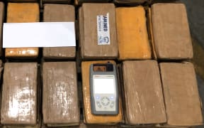 Packages of seized cocaine found in a shipping container from South America.