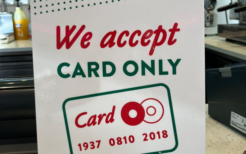 A card only sign at Krispy Kreme Doughnuts in Auckland