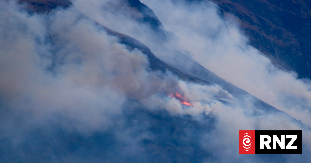 FENZ responding to vegetation fire on Walter Peak, smoke visible from Queenstown