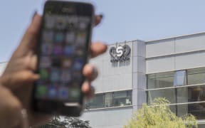 Phone in front of the building housing the Israeli NSO group, on August 28, 2016, in Herzliya, near Tel Aviv.