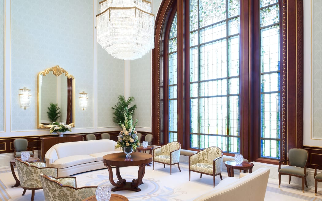The Celestial Room features a large stained glass window and chandellier