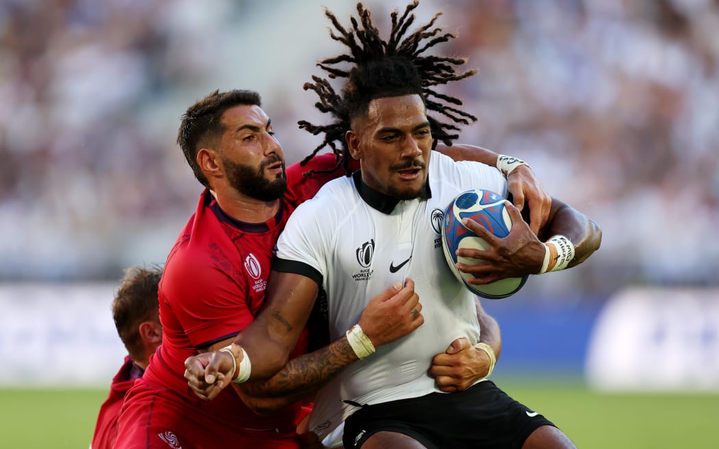 Selestino Ravutaumada of Fiji is tackled by Giorgi Kveseladze of Georgia during the Rugby World Cup France 2023 match between Fiji and Georgia at Nouveau Stade de Bordeaux on 30 September, 2023 in Bordeaux, France.