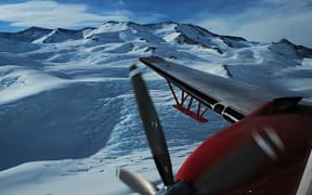 Planes and satellites are used to conduct surveys of the features that lie below the Antarctic Ice Sheet.