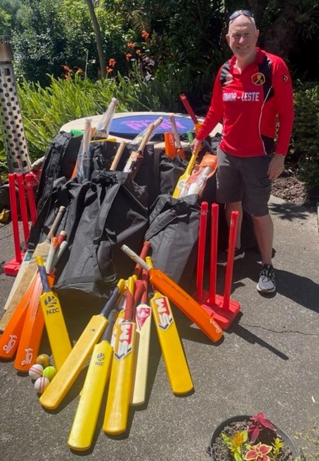 Mark Young with gear for Timor-Leste donated from Cricket Wellington